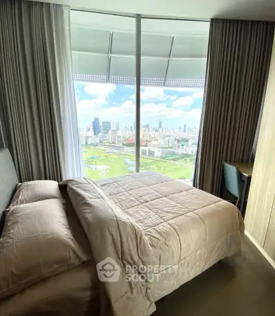 Luxurious bedroom with stunning city view from floor-to-ceiling windows, featuring elegant bedding and modern decor.
