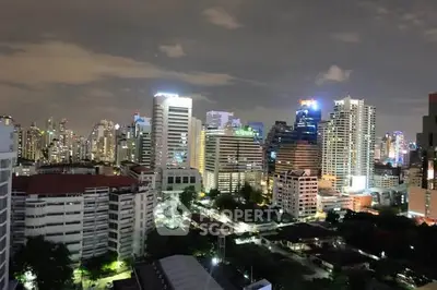 Stunning night view of a vibrant city skyline with illuminated skyscrapers and urban landscape.
