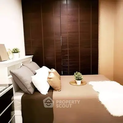 Cozy bedroom with elegant decor and plush bedding, perfect for relaxation.