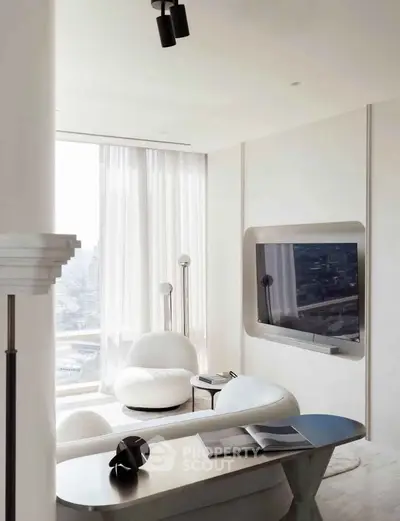 Modern living room with sleek furniture and large window offering city view.