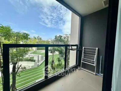 Spacious balcony with scenic garden view in modern apartment
