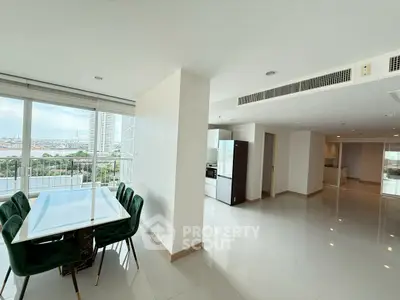 Spacious modern apartment with stunning city view and elegant dining area.