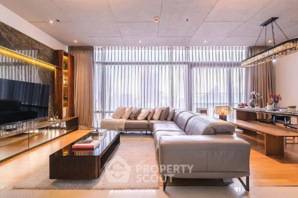 Luxurious modern living room with elegant decor and large windows