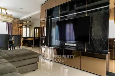 Luxurious living room with modern entertainment center and plush seating