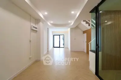 Spacious modern interior with elegant lighting and wooden flooring