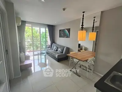 Modern living room with dining area and balcony view