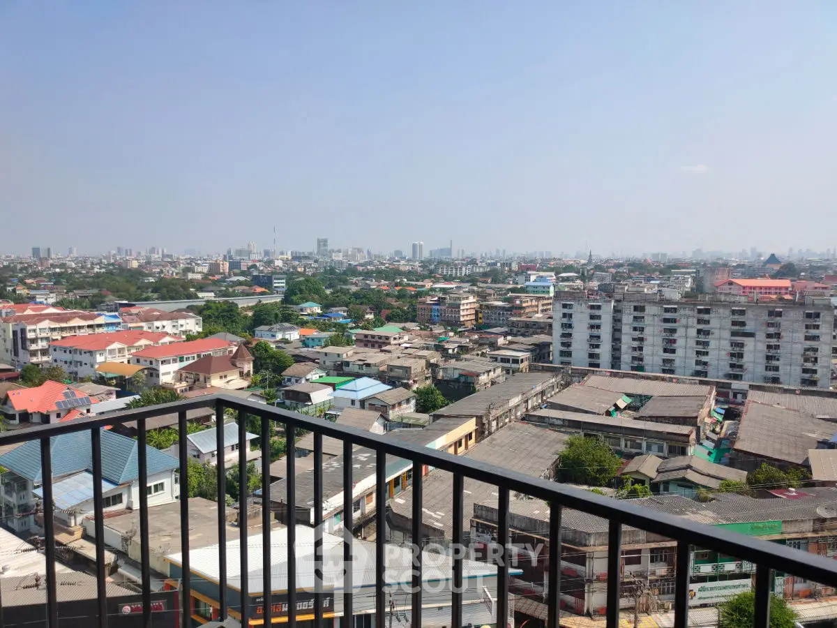 Stunning cityscape view from a high-rise balcony, showcasing urban living at its finest.