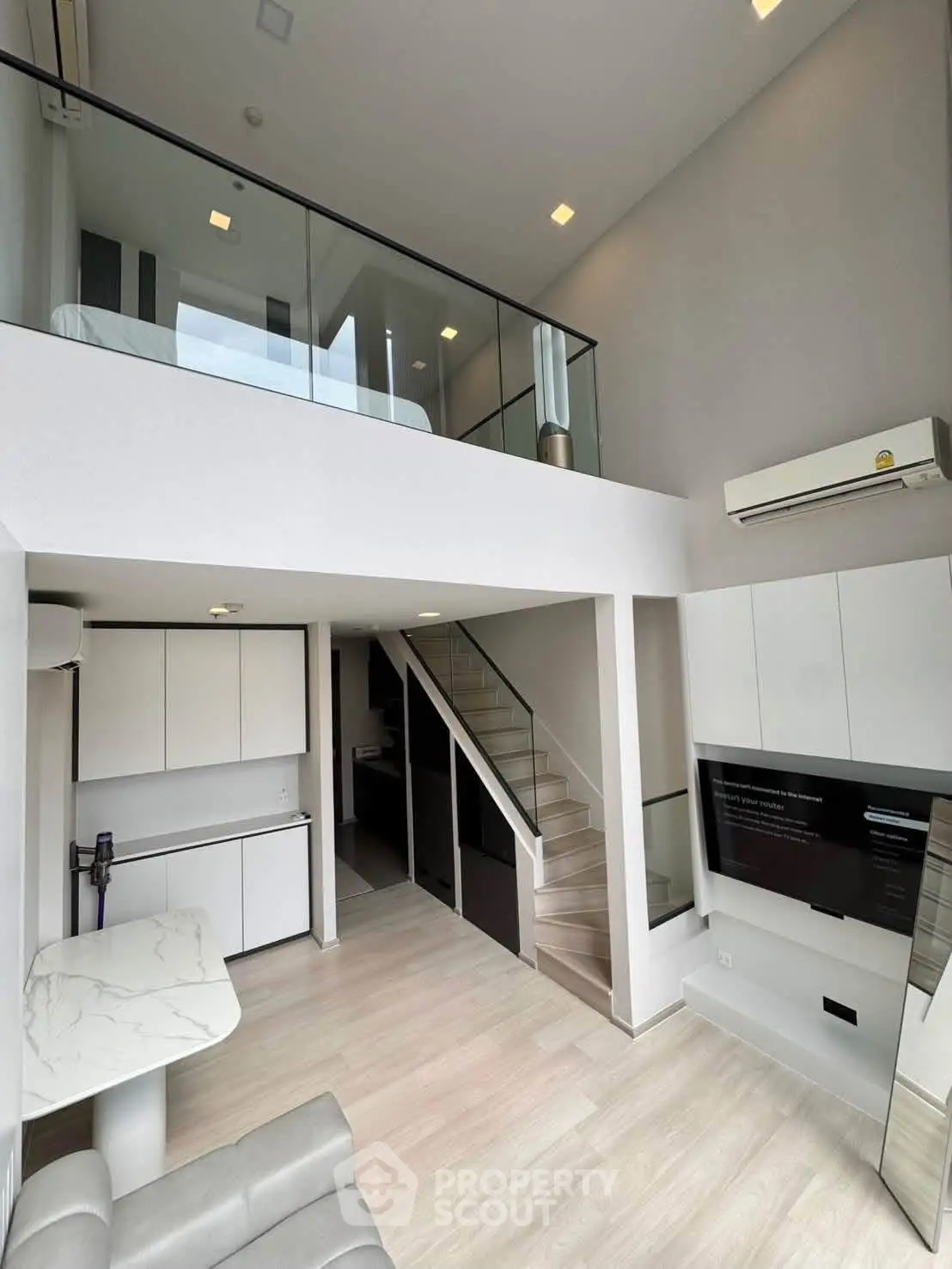 Modern loft apartment with mezzanine bedroom and sleek interior design