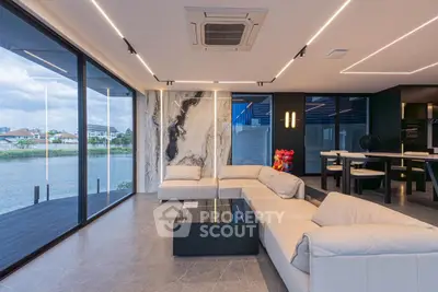 Luxurious modern living room with stunning river view and elegant marble accents