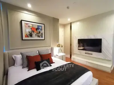 Luxurious modern bedroom with stylish decor and wall-mounted TV
