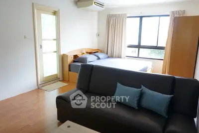 Cozy studio apartment with modern furnishings and natural light