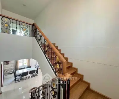 Elegant staircase with decorative railing in modern home interior