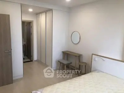 Modern bedroom with minimalist design and ample storage space