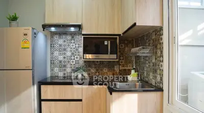Modern kitchen with stylish backsplash and stainless steel appliances