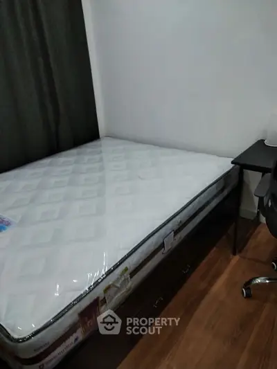 Cozy bedroom with new mattress and study desk, perfect for restful nights and productive days.