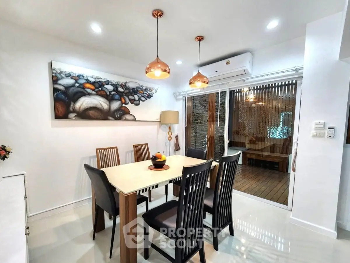 Elegant dining room with modern decor and stylish lighting