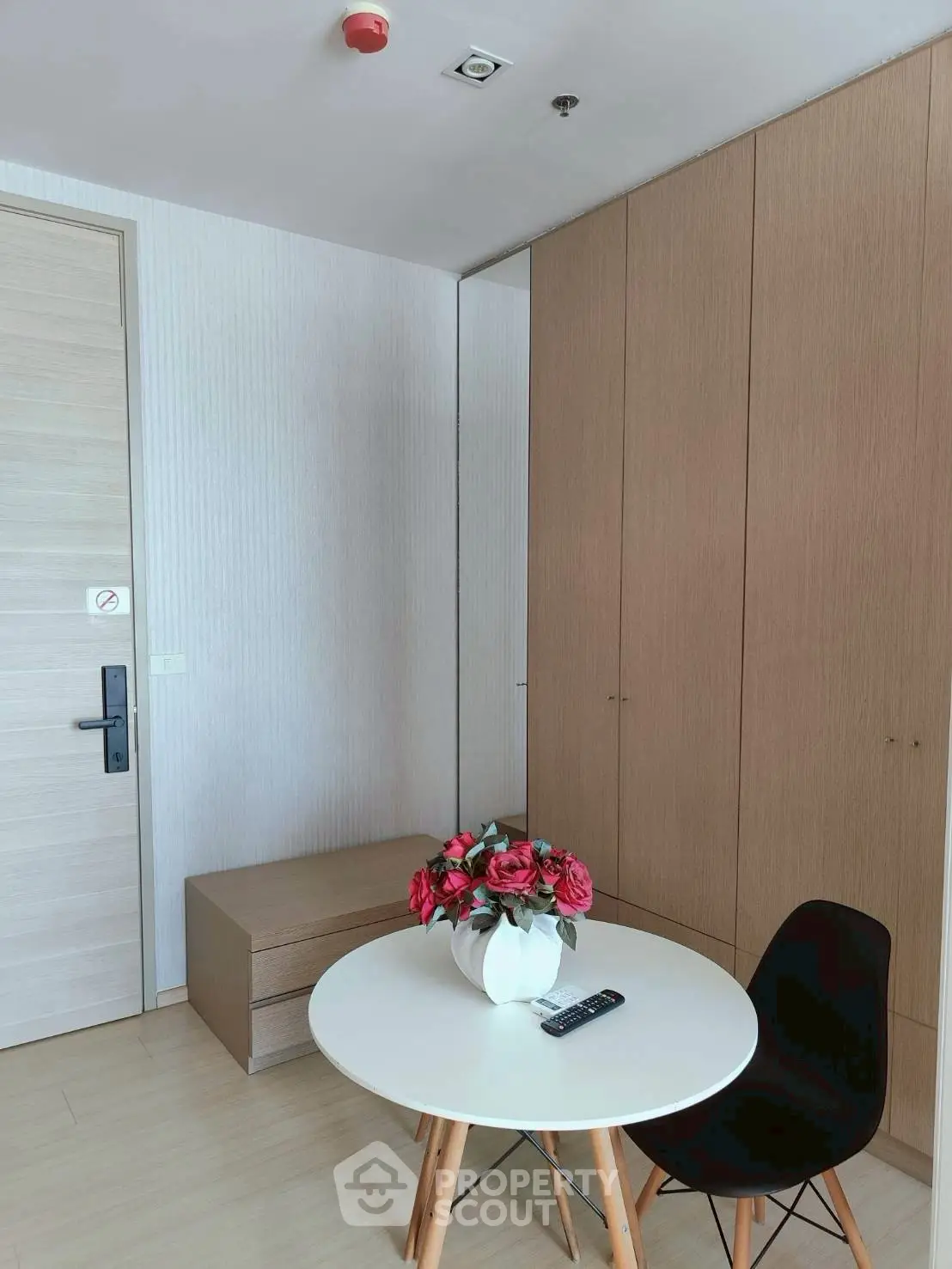 Modern interior with sleek wooden cabinetry and stylish decor in a cozy living space.