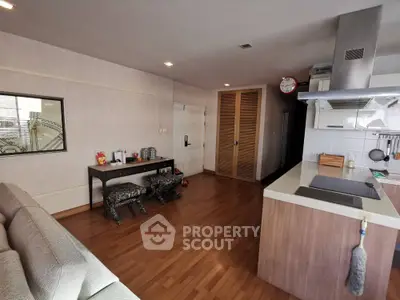 Spacious open-plan living area with modern kitchen and stylish decor
