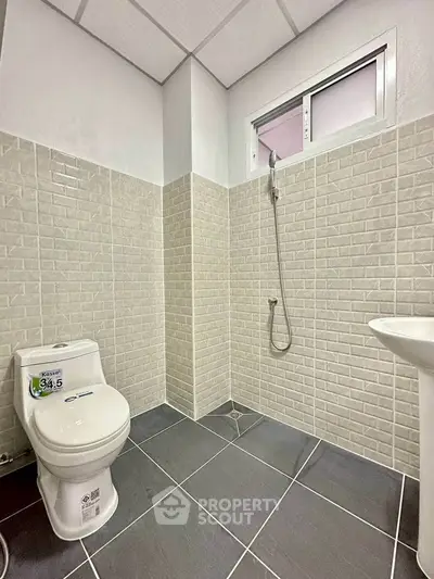 Modern bathroom with sleek tiles and minimalist fixtures