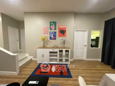 Stylish living room with modern decor and vibrant artwork on walls