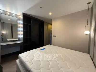 Modern bedroom with stylish lighting and spacious layout