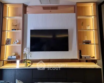 Modern living room with stylish TV wall unit and ambient lighting