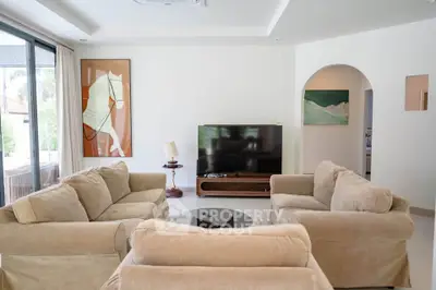 Spacious living room with plush sofas and modern decor