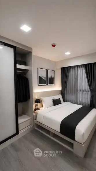 Modern bedroom with sleek design, featuring a cozy bed, stylish decor, and ample storage space.