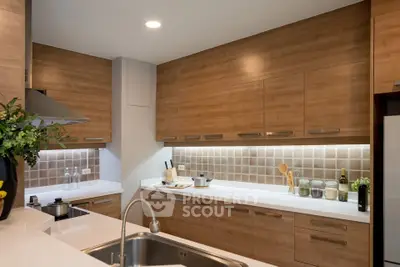 Modern kitchen with wooden cabinets and sleek countertops