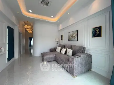 Luxurious living room with elegant decor and plush gray sofa in modern apartment