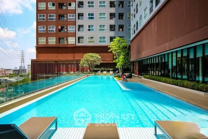 Luxurious rooftop pool with city views in modern apartment complex