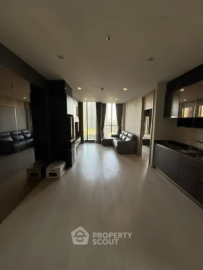 Spacious modern living room with open kitchen and large windows