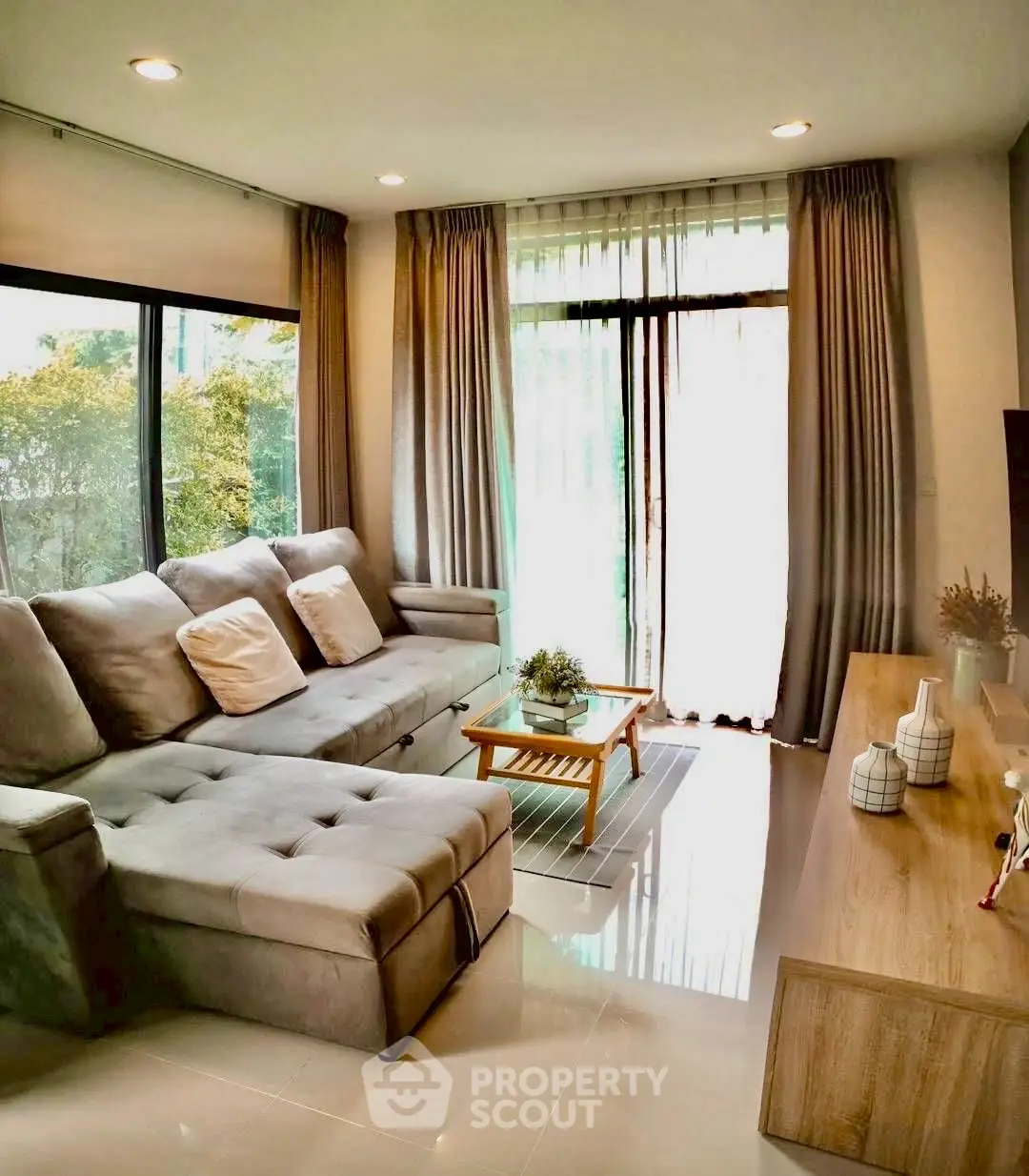 Modern living room with large windows and stylish decor