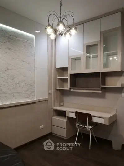 Modern study room with built-in desk and elegant lighting