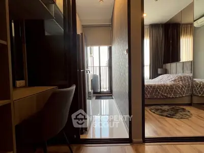 Modern apartment interior with sleek design, featuring a cozy bedroom and stylish study area.