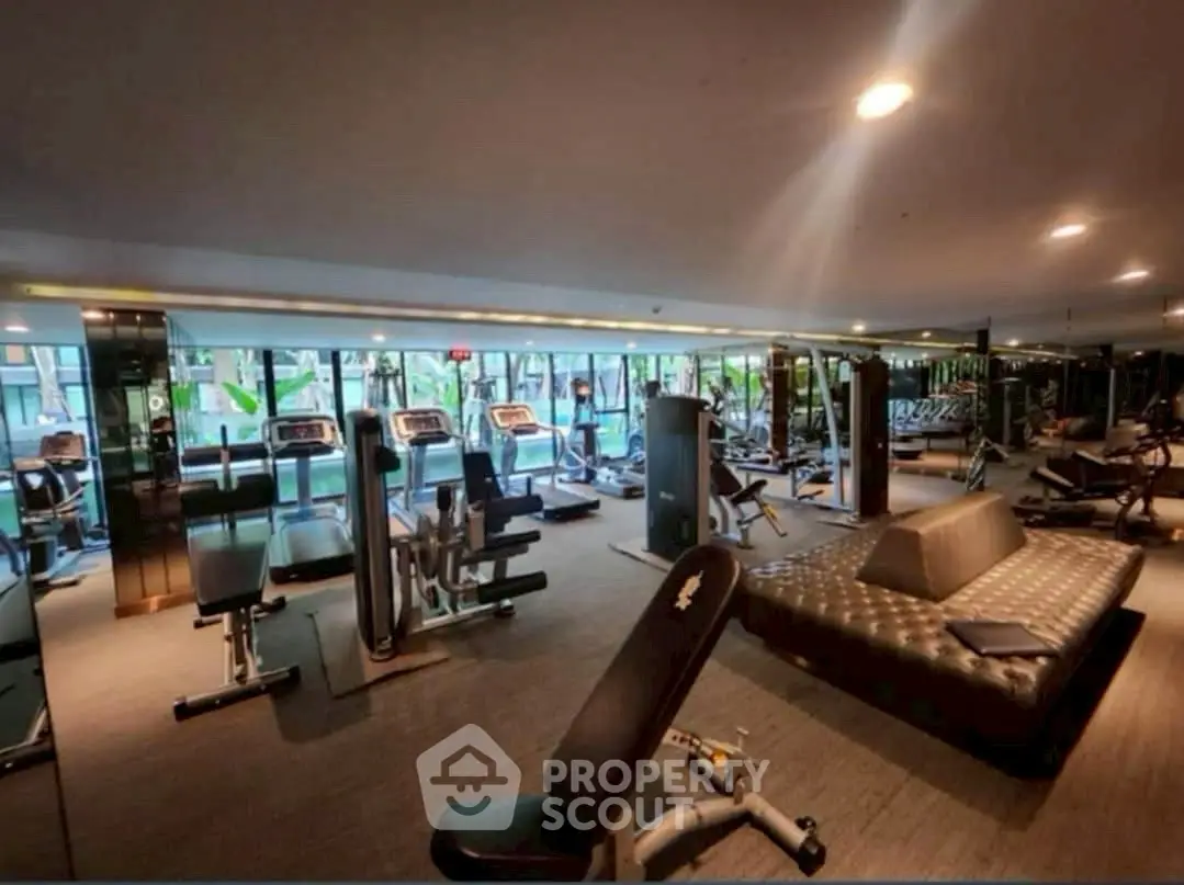 Luxurious modern gym with state-of-the-art equipment and stylish design.