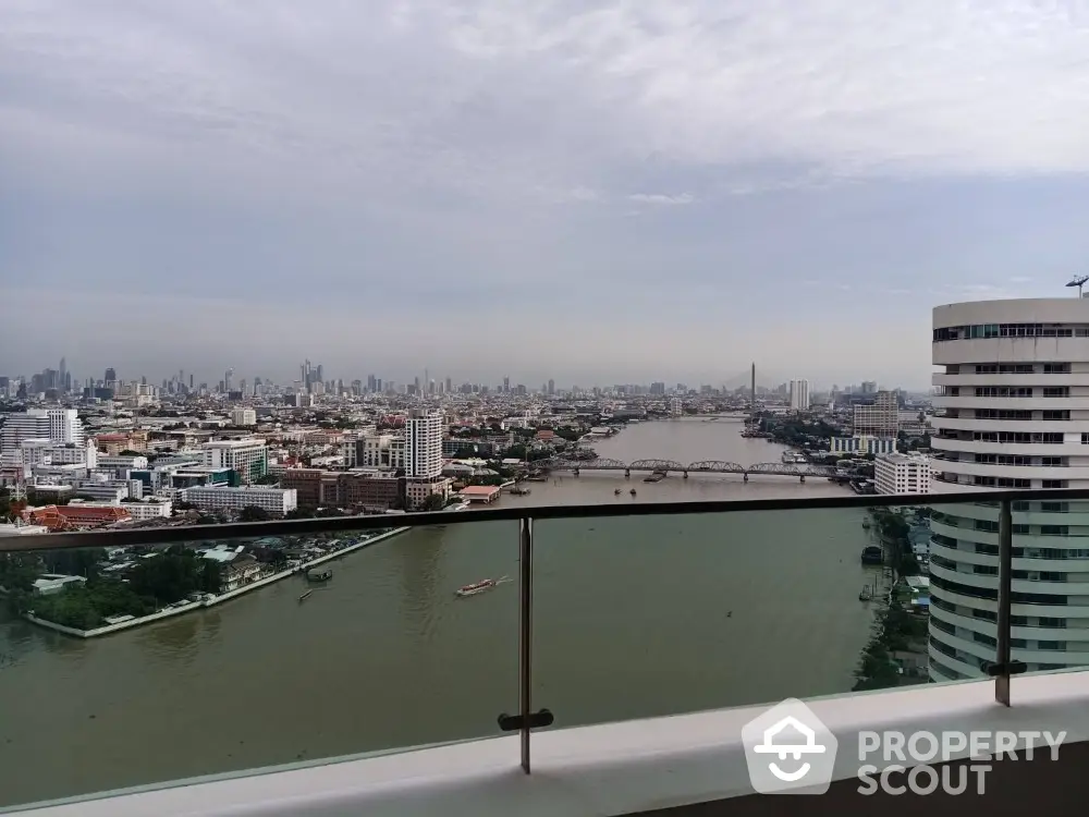 Stunning cityscape view from high-rise balcony overlooking river and skyline