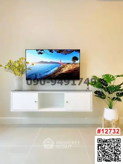 Modern living room with wall-mounted TV and stylish decor