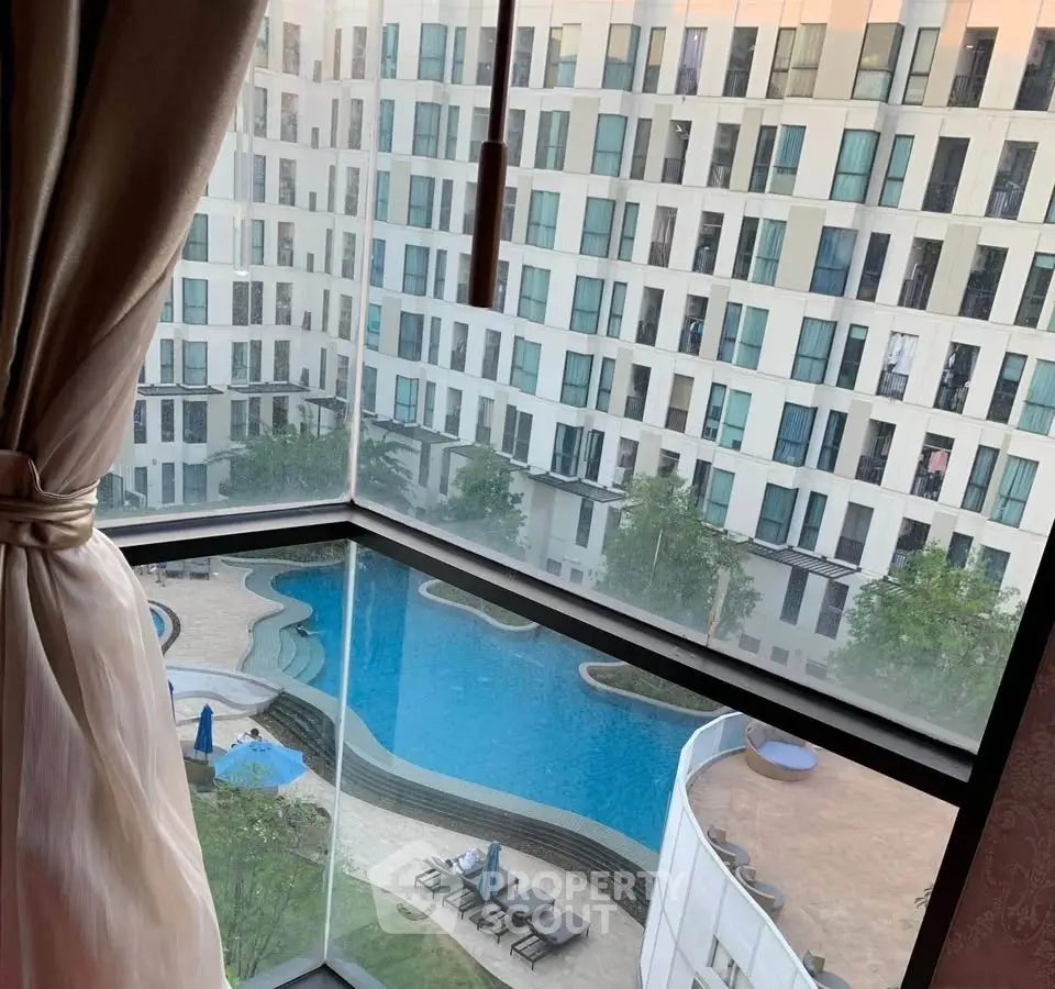 Luxurious apartment view with pool and modern building exterior