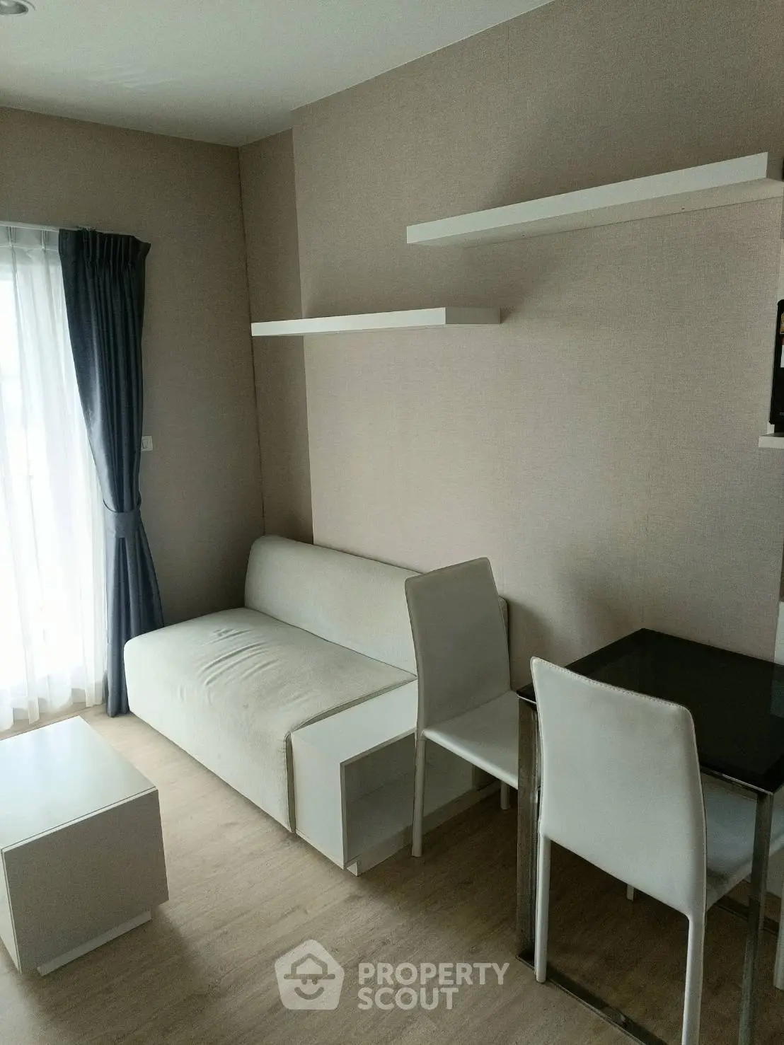 Modern living room with minimalist furniture and natural light