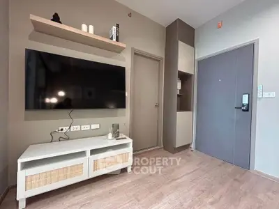 Modern living room with wall-mounted TV and stylish decor