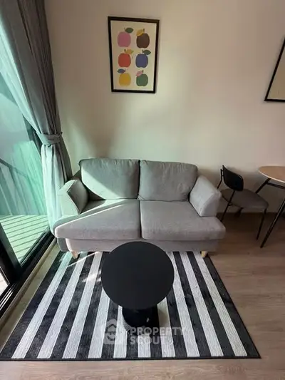 Cozy living room with modern sofa and stylish decor, perfect for relaxation.