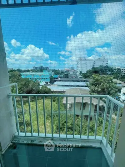 Charming balcony with a stunning cityscape view, perfect for relaxation and enjoying the outdoors.