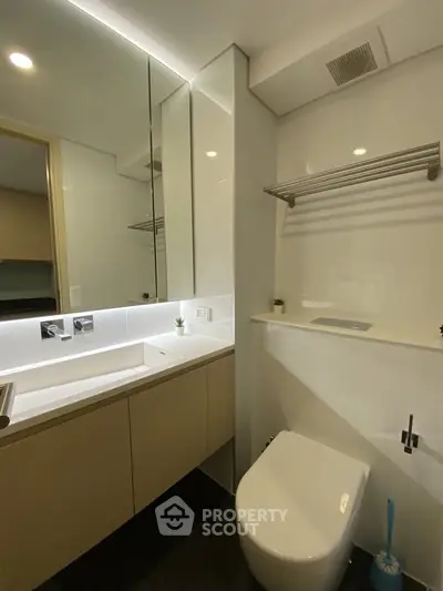Modern bathroom with sleek fixtures and ample storage space