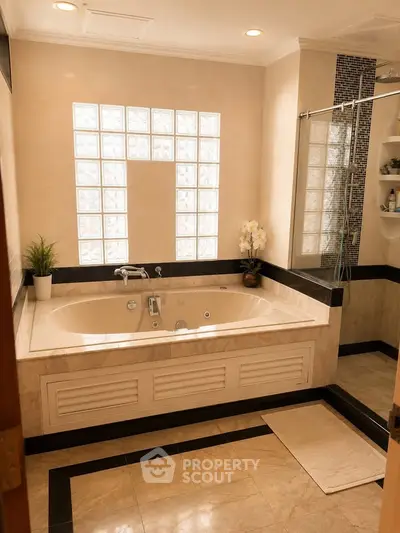 Luxurious bathroom with elegant bathtub and stylish tile design