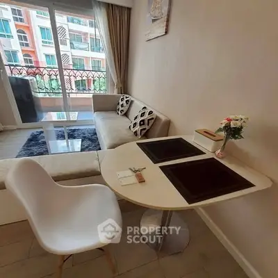 Cozy living room with modern furniture and balcony view