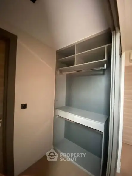 Spacious walk-in closet with modern shelving and storage solutions.