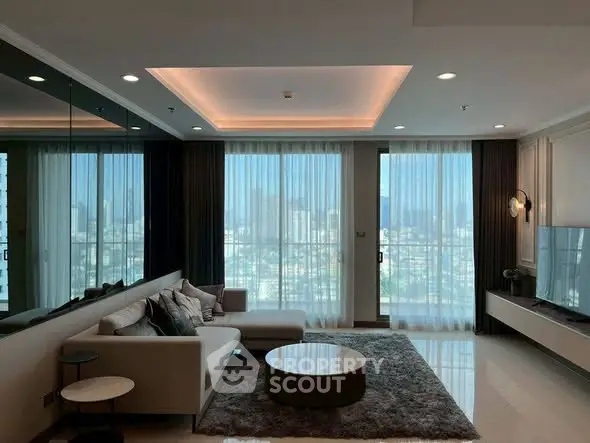 Luxurious living room with city view, modern decor and ample natural light.