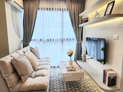Chic modern living room with cozy sofa, stylish shelves, and large window with elegant curtains.