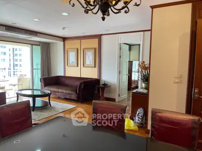 Spacious living room with elegant decor and large windows in a modern apartment.